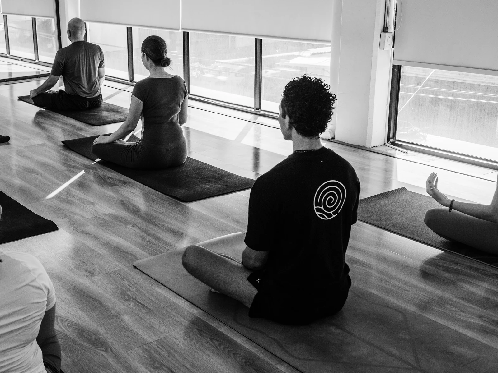 A group in guided practice inside the studio